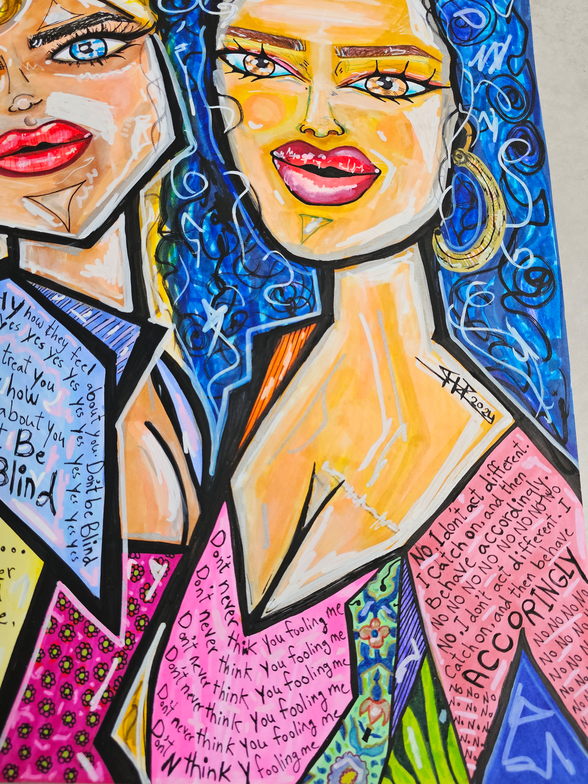 Karma & Charma detail: the two figures at an angle above pink panels and the word accordingly