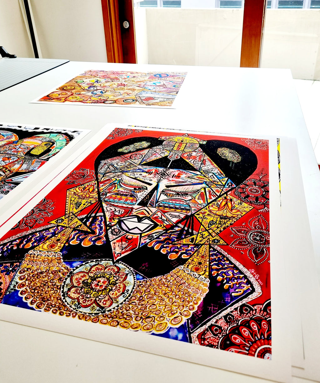 A Shabsoug Art fine art print seen close up, showing the paper surface, the white border and the printed detail