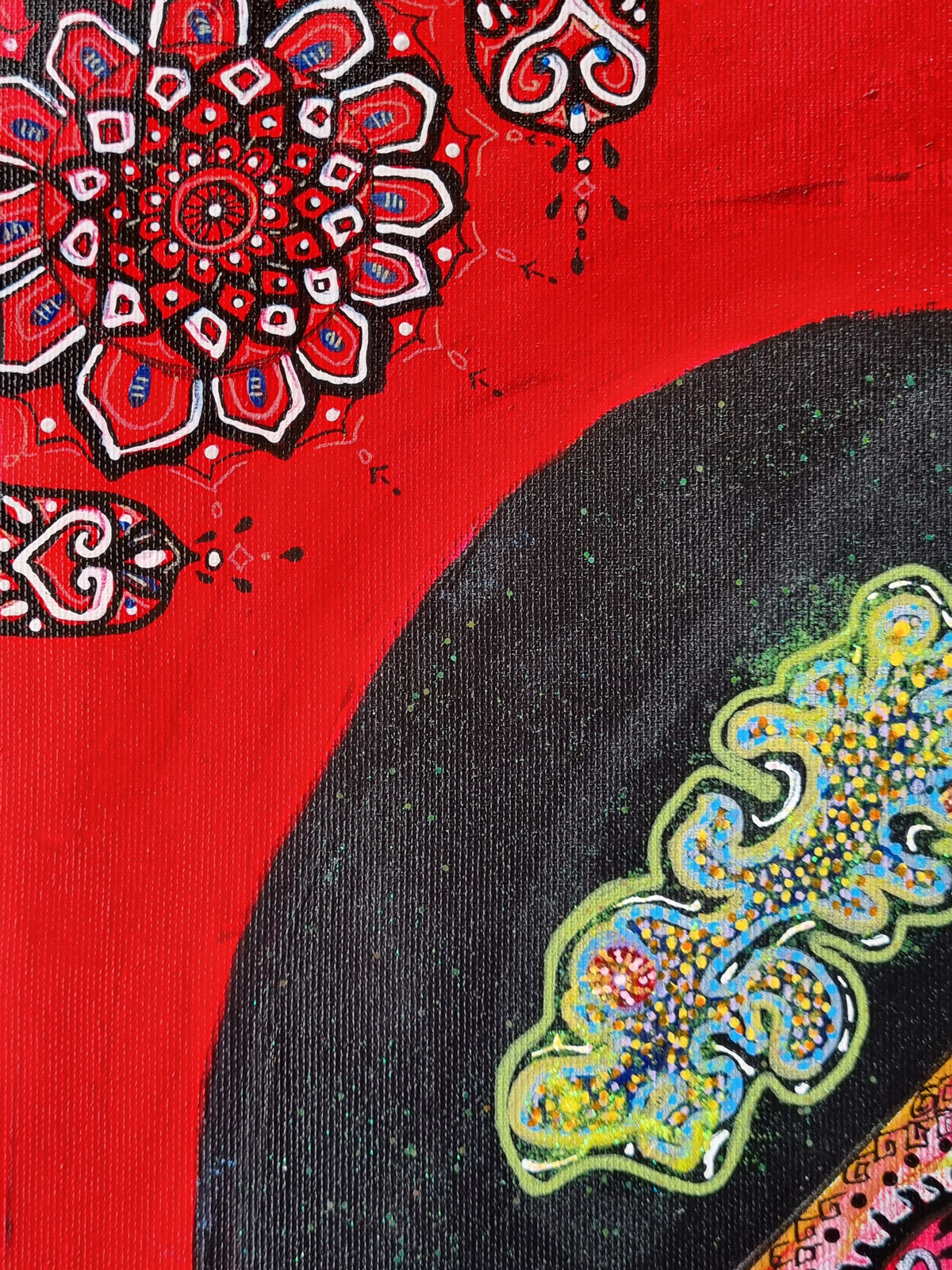 Bishop detail: a black arc edged with gold ornament curving across red, red mandalas below