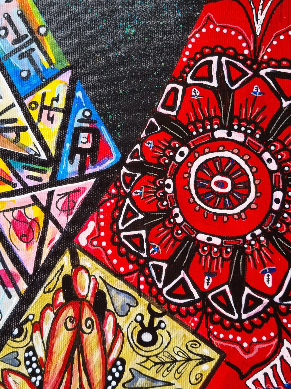 Bishop detail: a red and black mandala above triangles of blue, pink and gold pattern