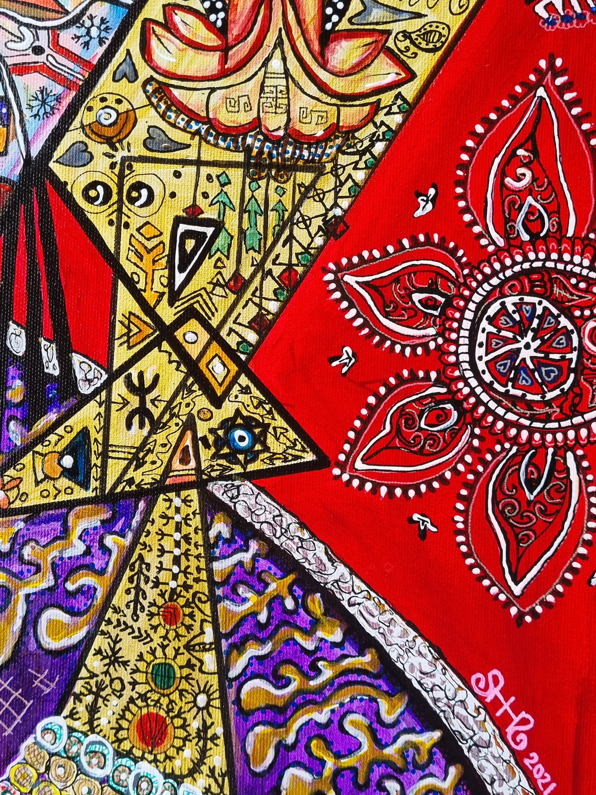 Bishop detail: a red and white paisley mandala above gold triangles, the artist's signature in pink