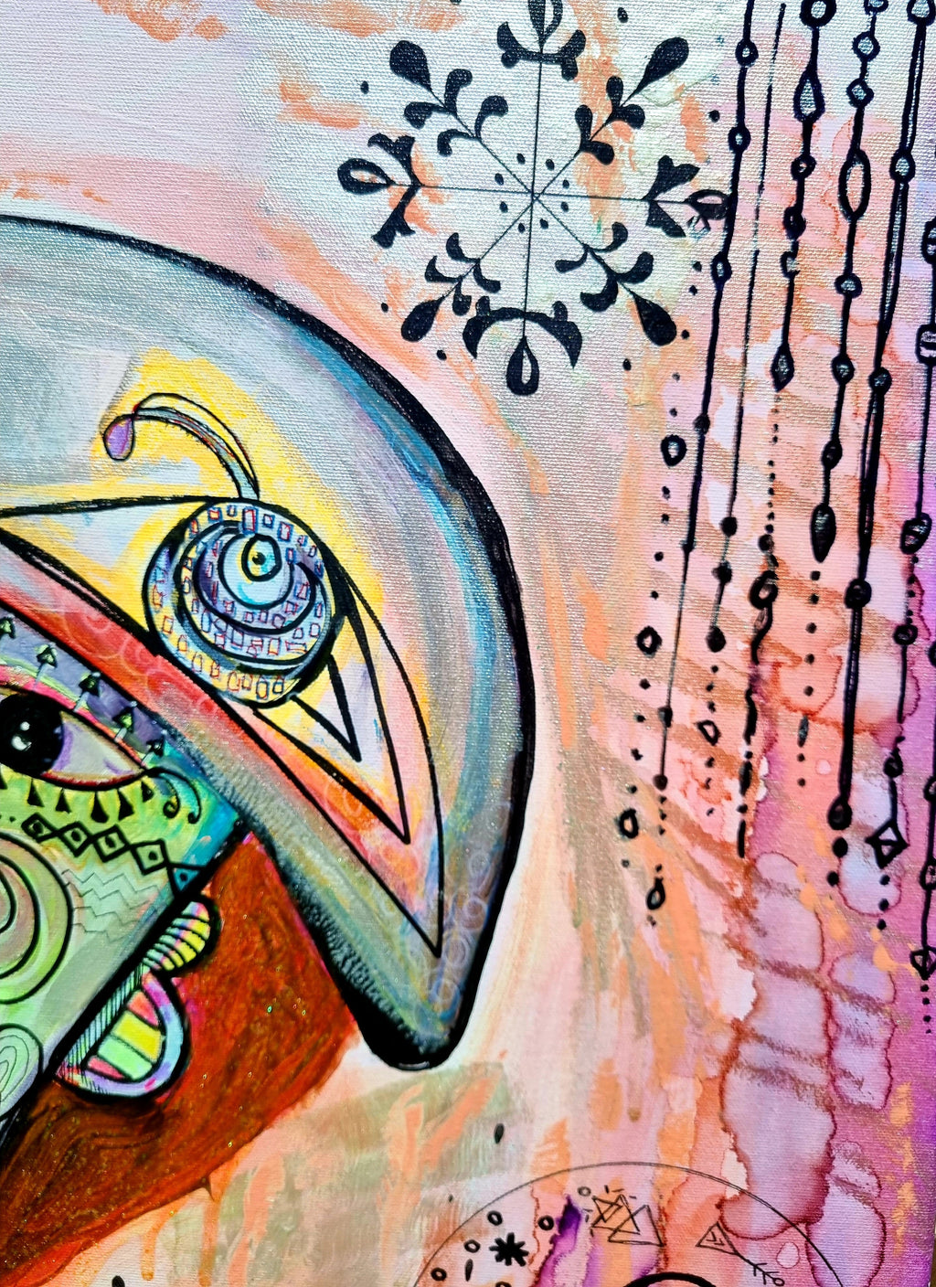 Rosado print detail: a blue brow and pale eye beside inked snowflakes and hanging beads