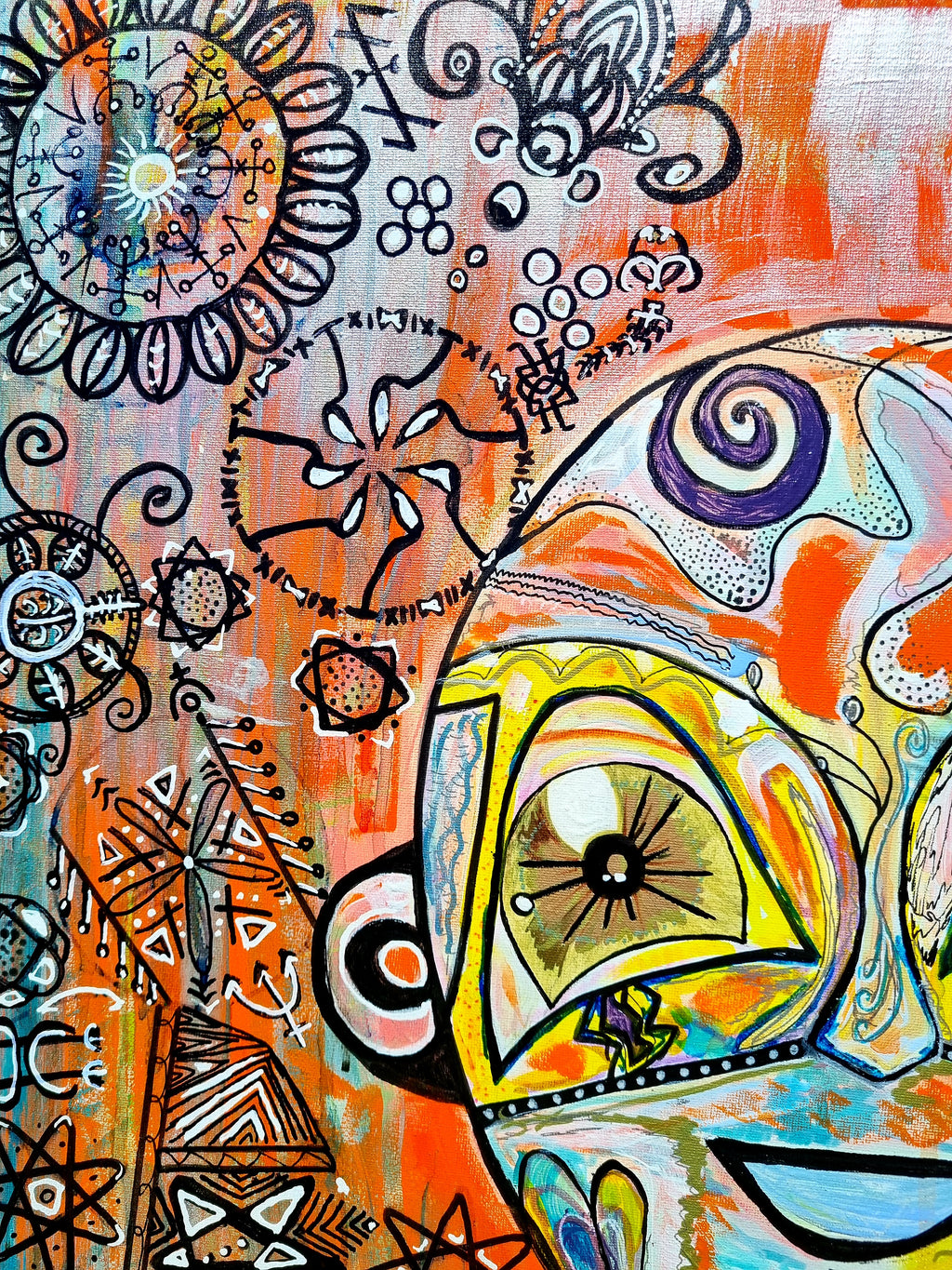 Naranja detail: one yellow eye with a black starburst pupil below inked mandalas and a spiral