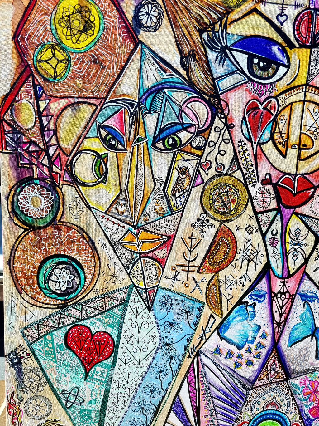 Trinity print detail: a red heart at the base of a tall figure built from patterned facets