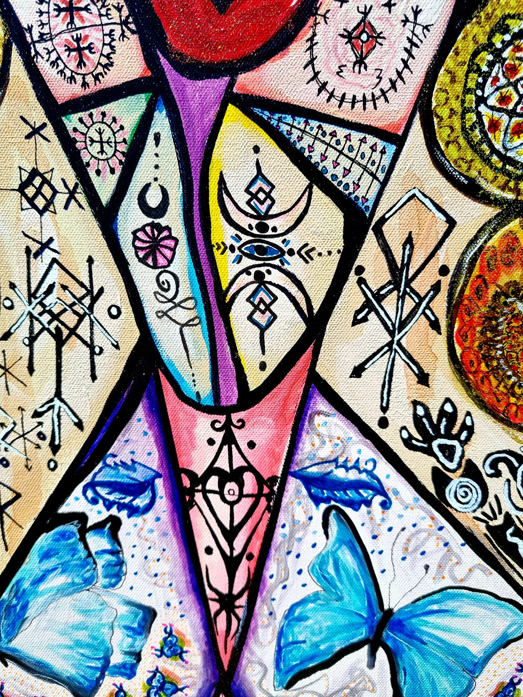 Trinity detail: two blue butterflies among pale triangles and hand drawn symbols