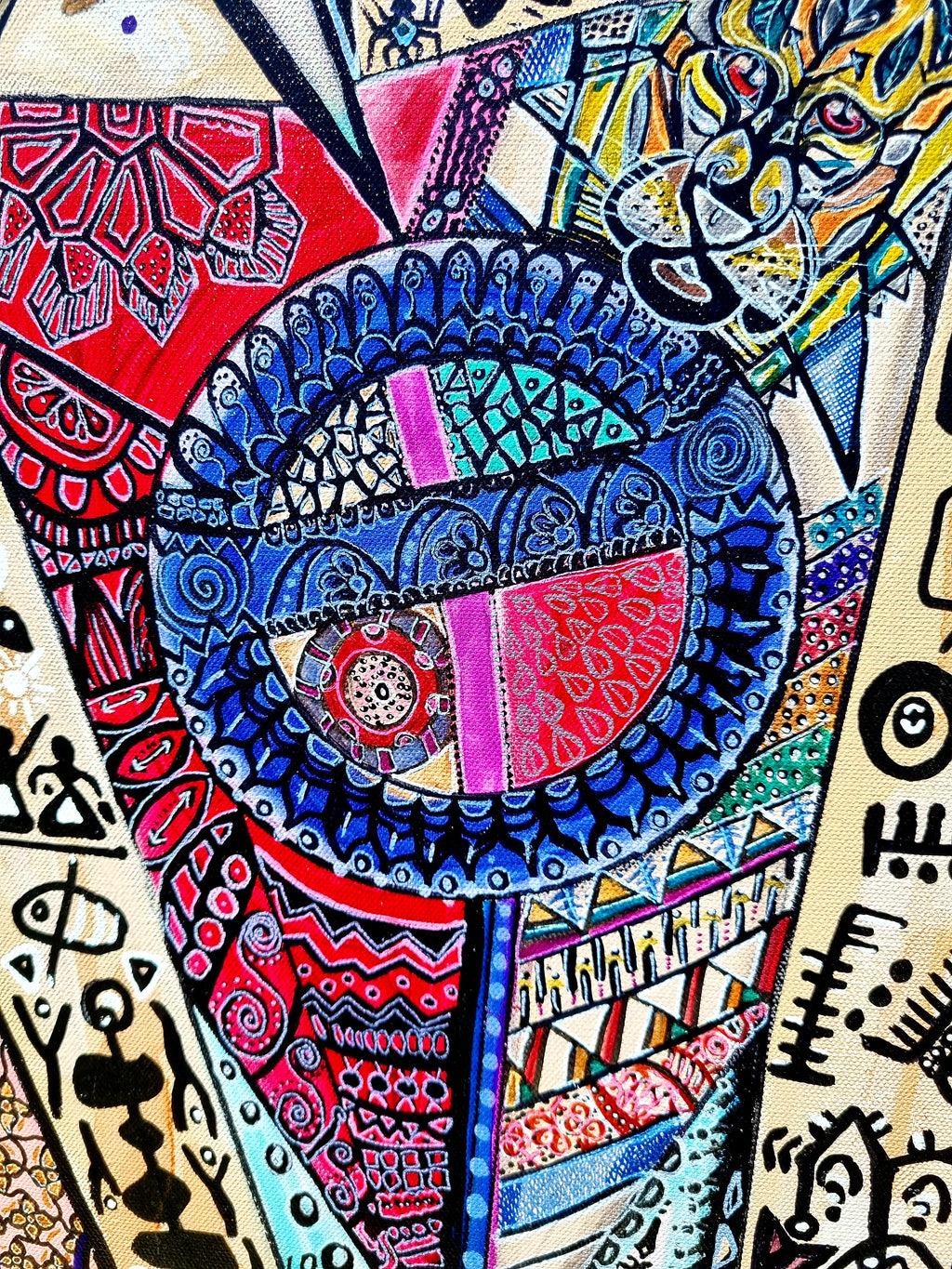 Trinity detail: a deep blue and red mandala disc surrounded by fine black line work