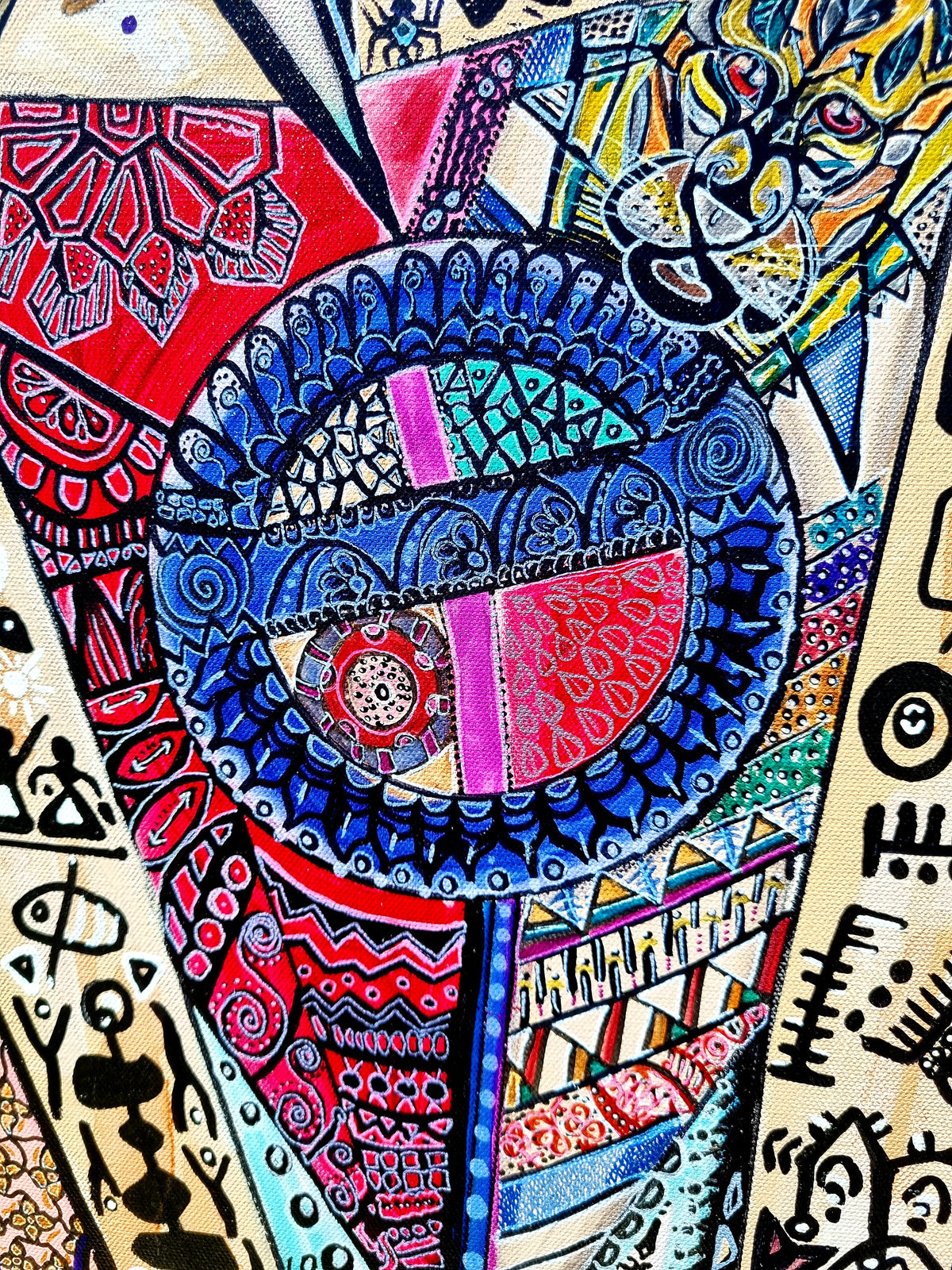 Trinity detail: a deep blue and red mandala disc surrounded by fine black line work