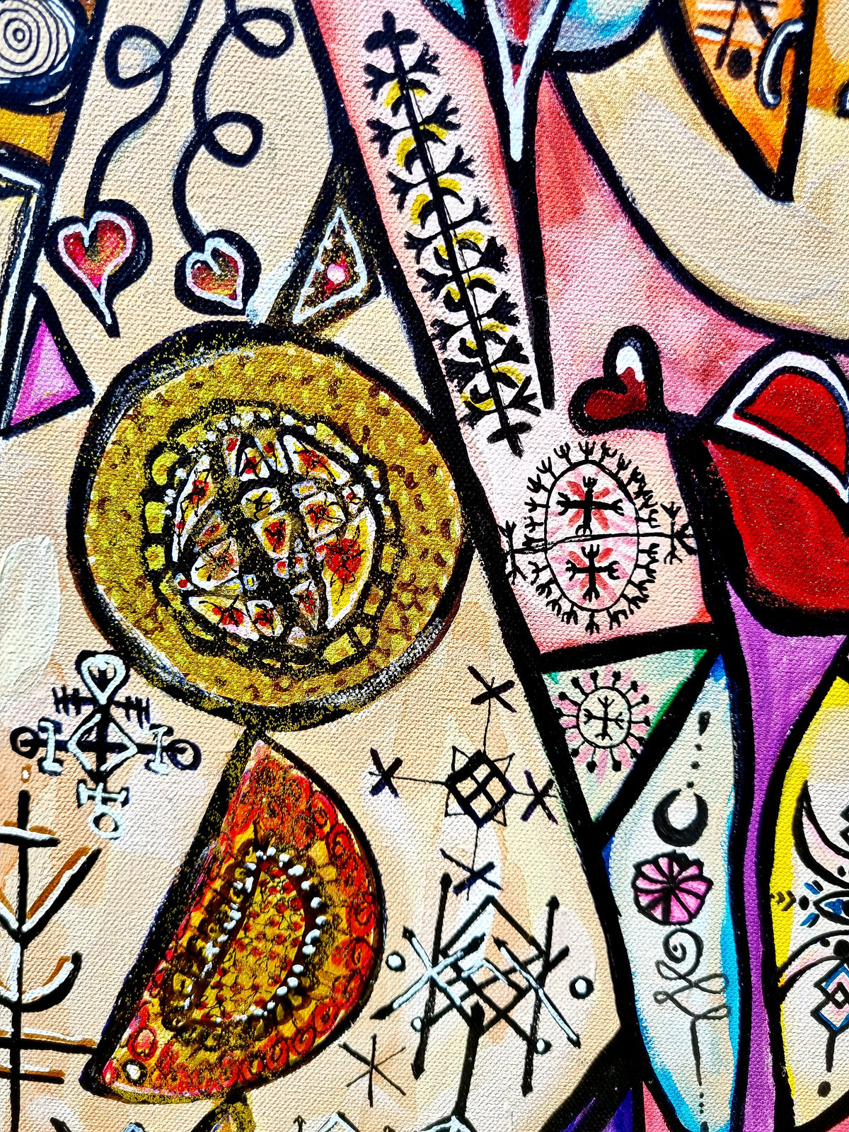 Trinity detail: a gold mandala disc ringed by hand drawn runes and small hearts