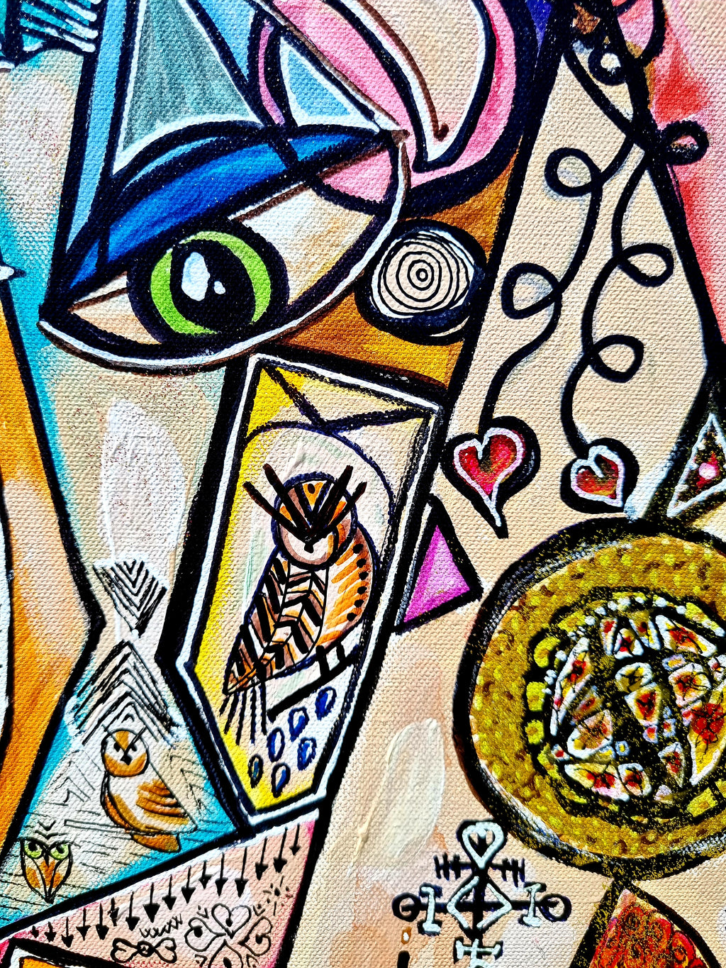 Trinity detail: a green eye above a small owl painted inside a narrow panel