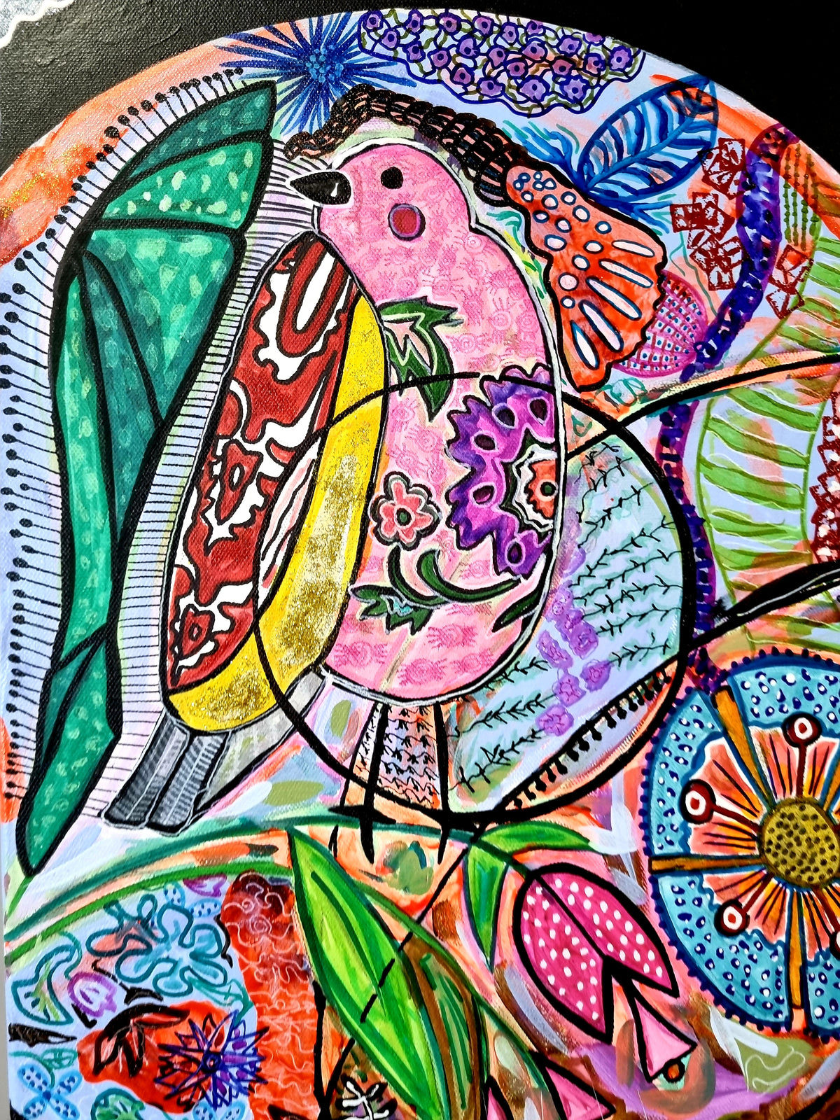 Wiana detail: a pink bird among green and blue leaf shapes on a black ground