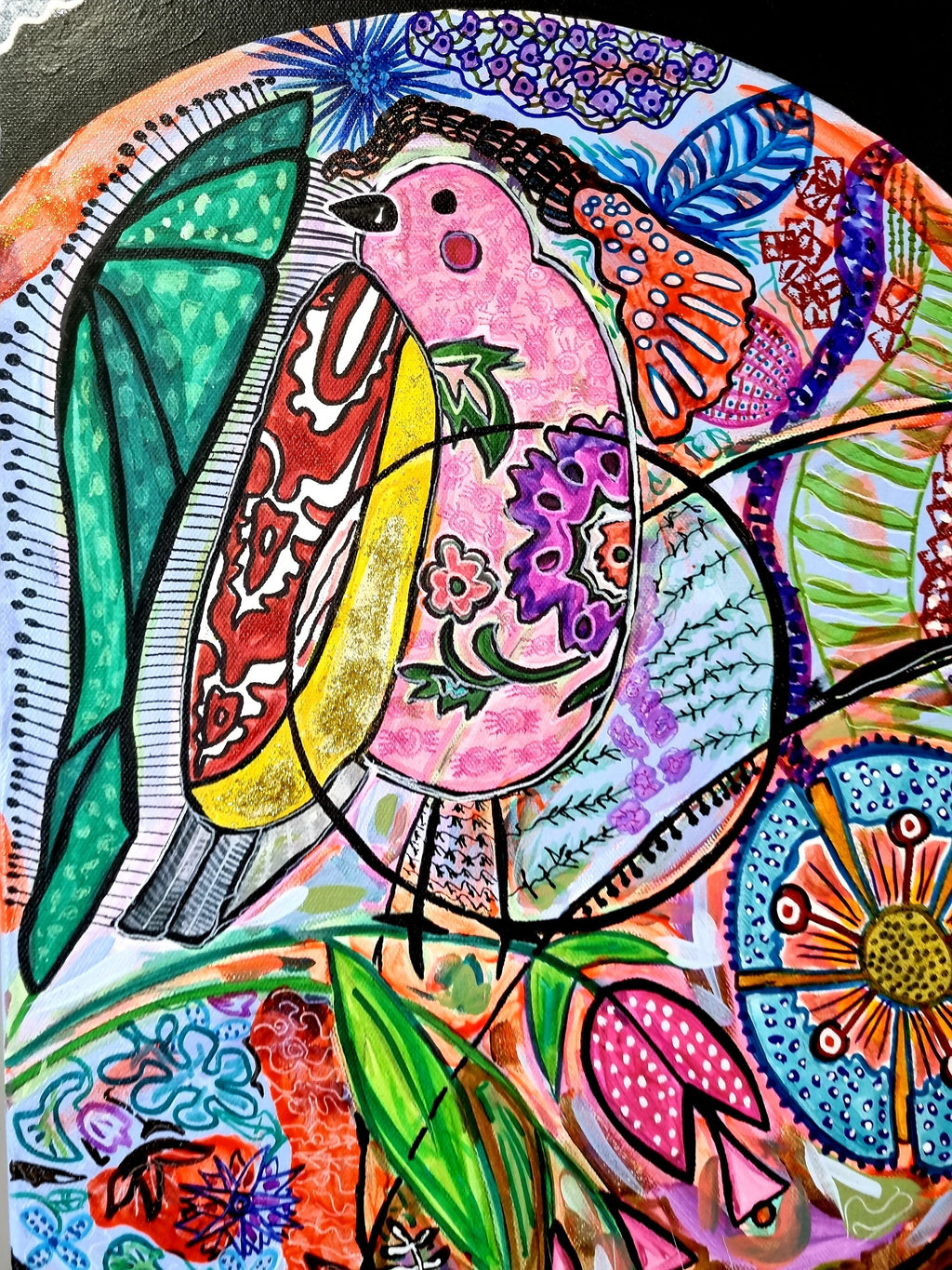 Wiana print detail: a rosy bird with an emerald wing among tulips and daisy wheels
