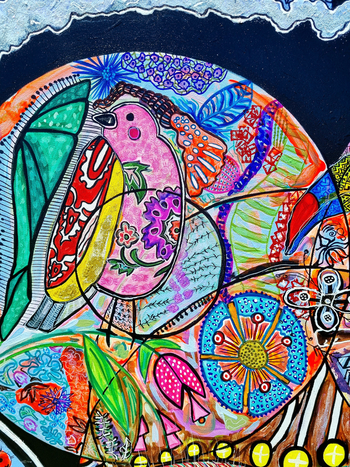 Wiana detail: a bird crossing a teal circle against the deep blue upper corner of the canvas