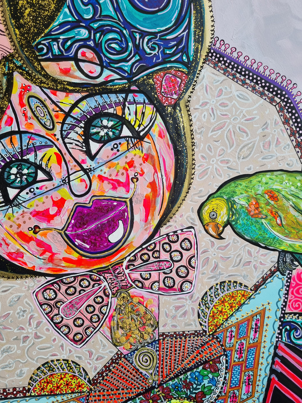 Kitty Kat detail: the cat's magenta mouth and wide eyes, with a small green parrot at her shoulder