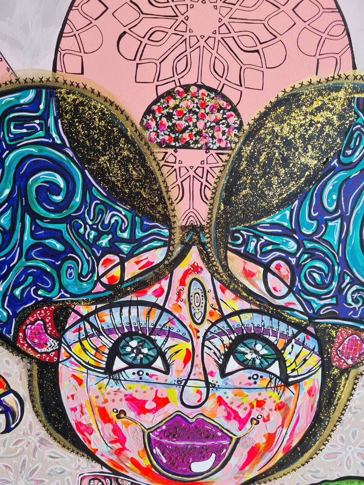 Kitty Kat detail: the gold and teal ears above a pink mandala brow and wide lashed eyes