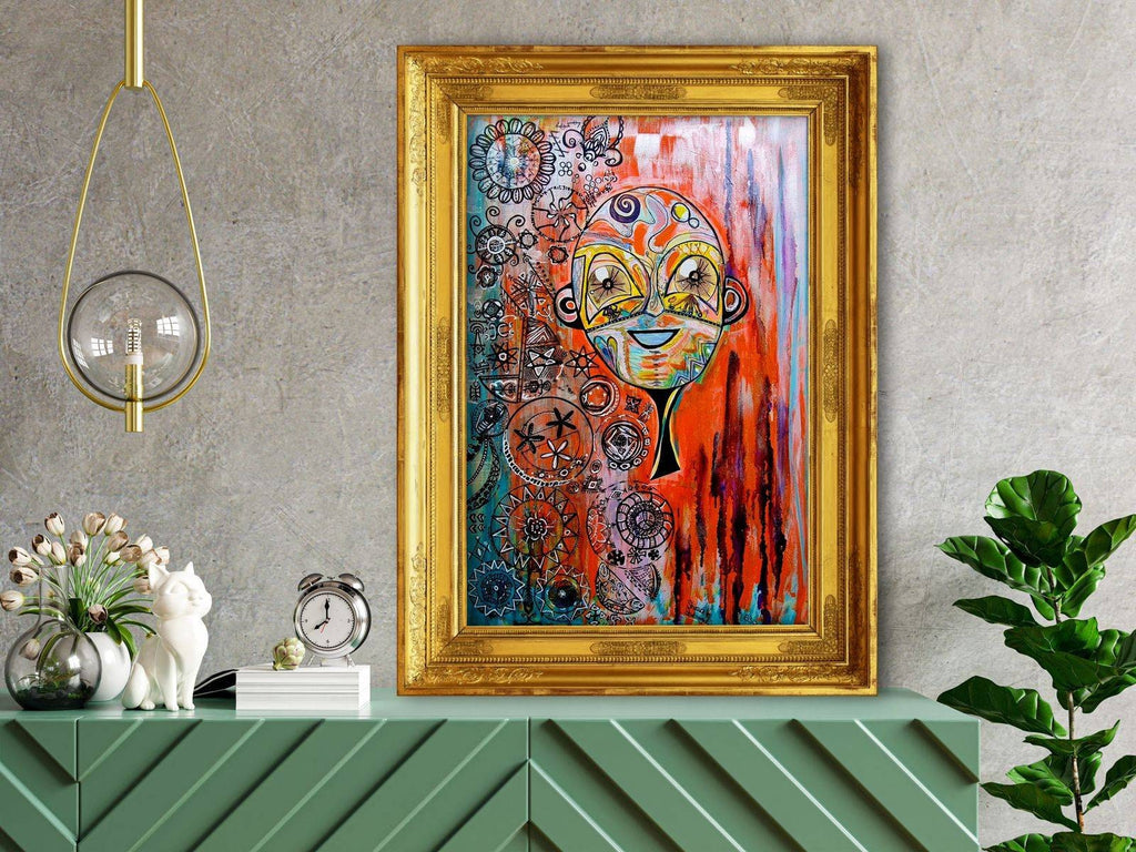 Naranja in a gilt frame on a grey wall above a green sideboard with flowers and a fiddle leaf fig