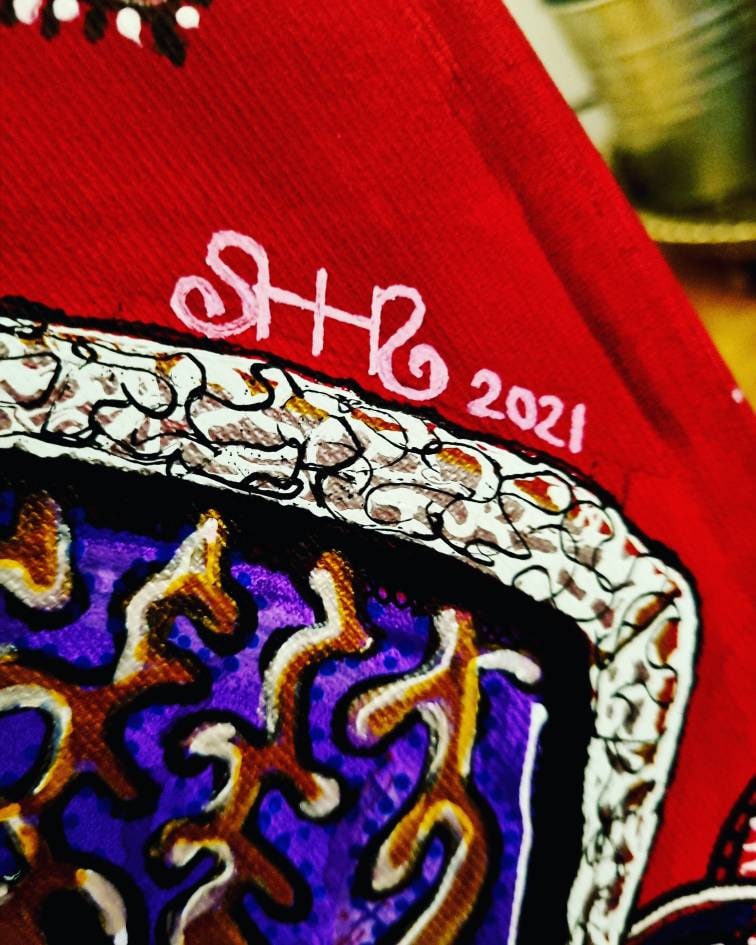 Bishop detail: the artist's signature and the year 2021 painted in white on the scarlet ground