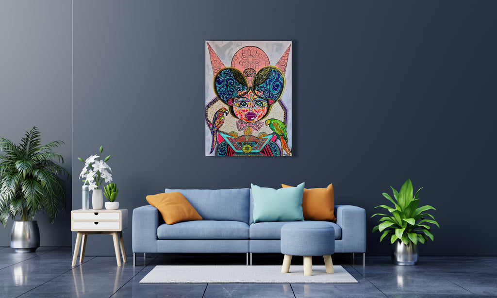 Kitty Kat on a dark navy wall above a grey sofa with blue and green cushions