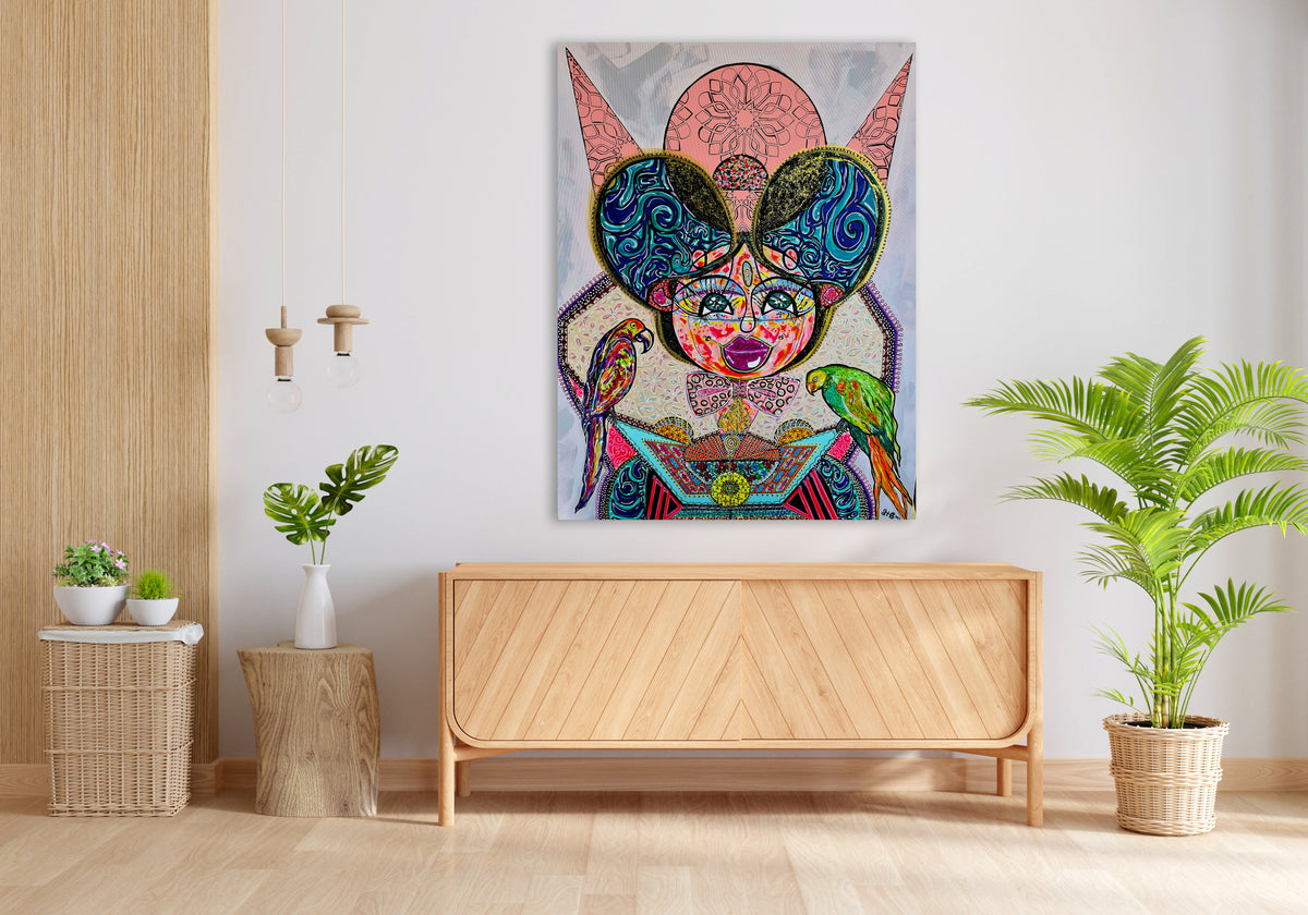 Kitty Kat on a white wall above a light wood sideboard, with a potted fern beside it
