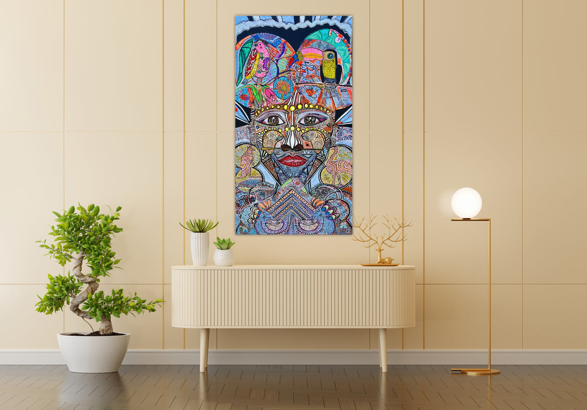 Wiana hanging on a cream wall above a pale sideboard with potted plants, showing the canvas in a room