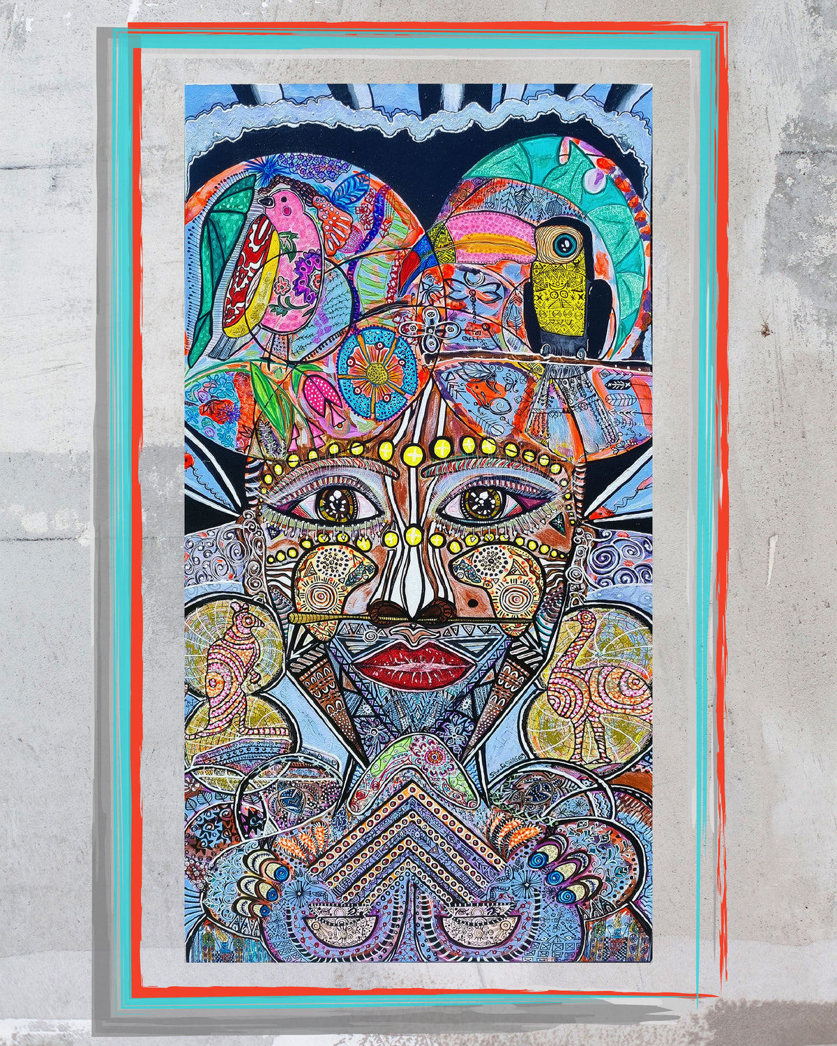 Wiana mounted on a raw concrete wall inside a painted red and turquoise border
